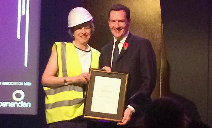 Theresa May dresses up in a hi-viz jacket to mock George Osborne